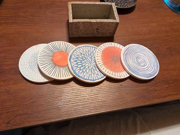 reviewer photo of five coasters on a table