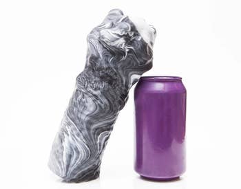 Stroker next to soda can to show size