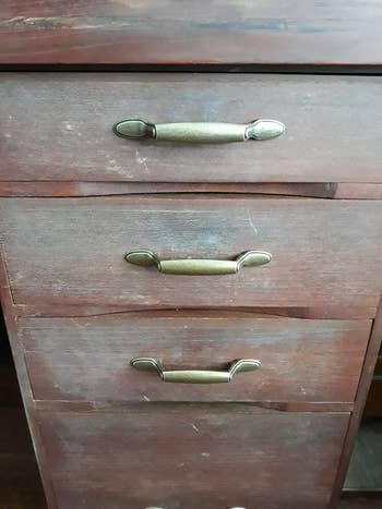 reviewer's dull and damaged looking wood   cabinet