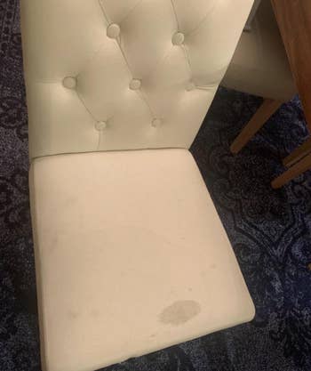 before photo showing stain on a reviewer's chair