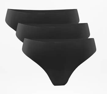 Three achromatic seamless panties are stacked, showcasing a smooth, no-show plan for shopping-related content