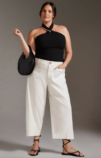 model wearing the pants in white