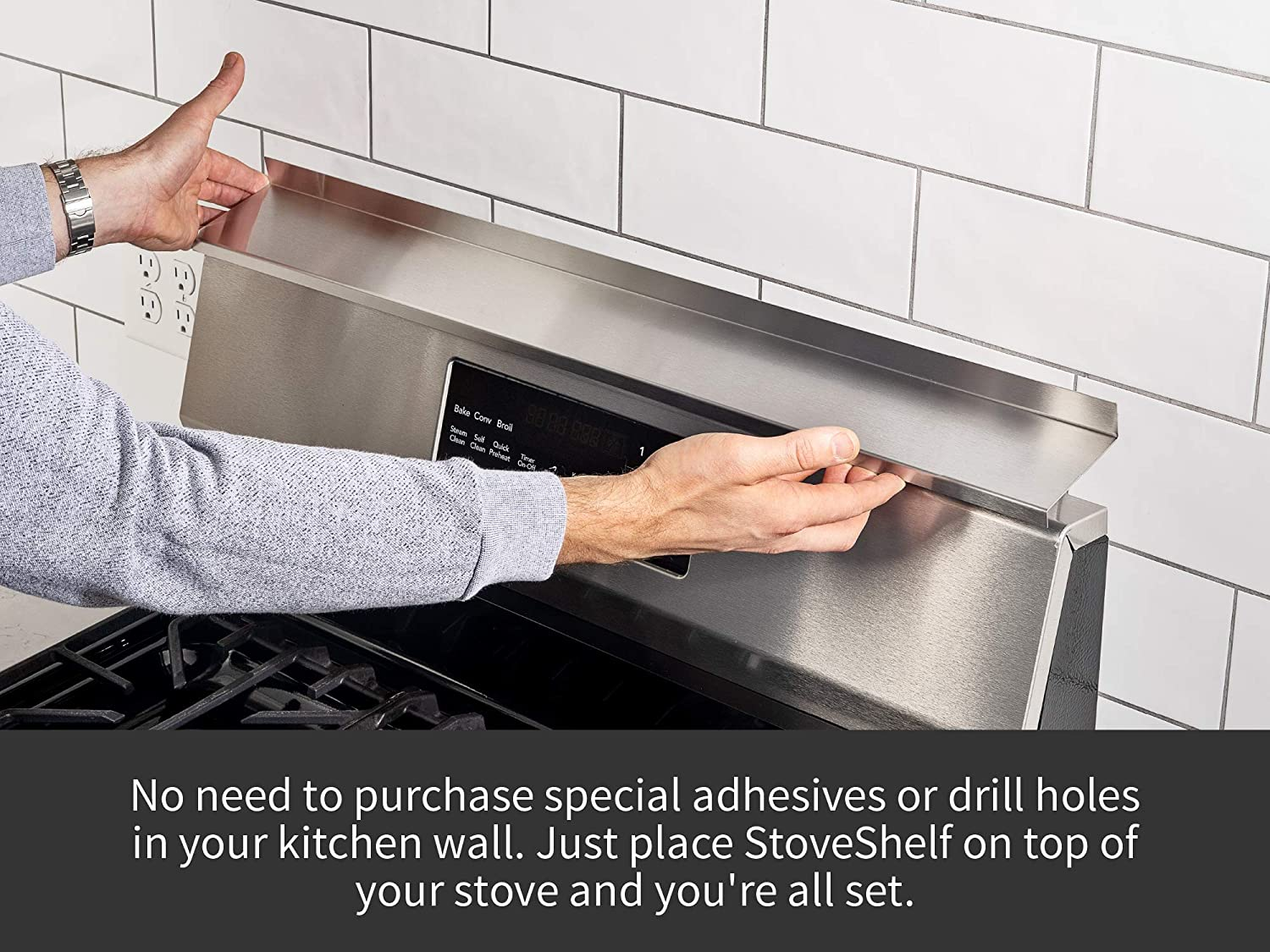 person putting a stainless alloy  stove support  connected  apical  of a stove