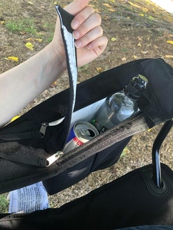 reviewer photo of them using the cooler with drinks inside of it