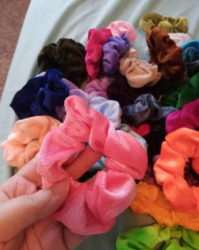 reviewer image of various colored hair scrunchies