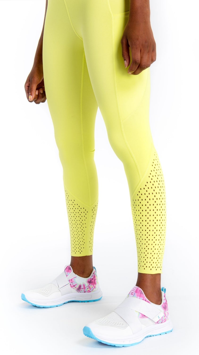 model wearing the leggings in bright yellow