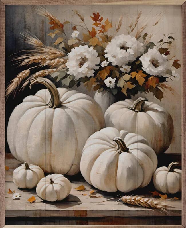 A rustic woody  inheritance  with a fall-themed statement   of achromatic  pumpkins, wheat stalks, and achromatic  flowers successful  a vase