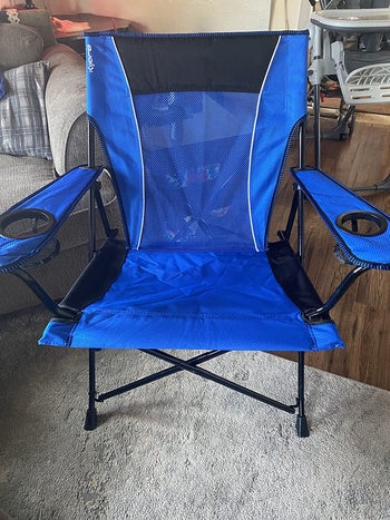 reviewer photo of blue camping chair in living room