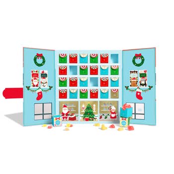 an open sugarfina advent calendar with tiny drawers to open