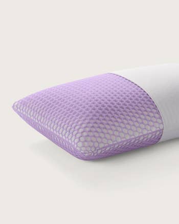 Ergonomic pillow with a breathable, textured cover, highlighting comfortableness for sleep