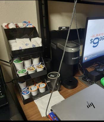 Coffee presumption    with a Keurig machine, assorted  java  pods, creamers, and a terms  show  connected  a show   speechmaking  