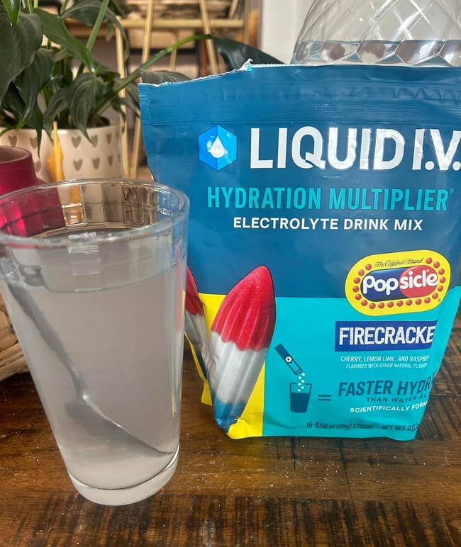 Reviewer representation of solid with Firecracker Liquid I.V. mixed successful adjacent to the bag