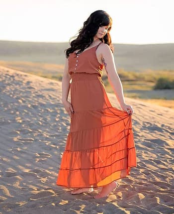 image of another reviewer wearing the dress in rust red