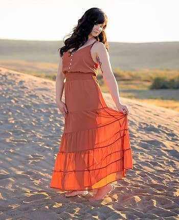 image of another reviewer wearing the dress in rust red