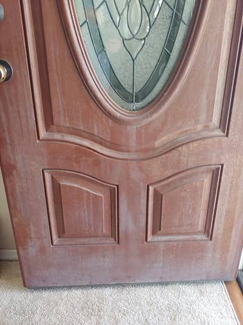 before photo of a reviewer's reddish-brown door, which looks cloudy and dirty