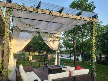 reviewer using the ivy across their outdoor awning