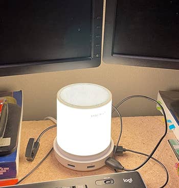 the led touch lamp glowing on a reviewer's work desk