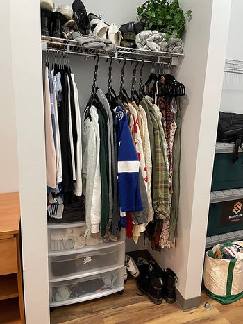 reviewer photo of closet organized with the multi-hangers