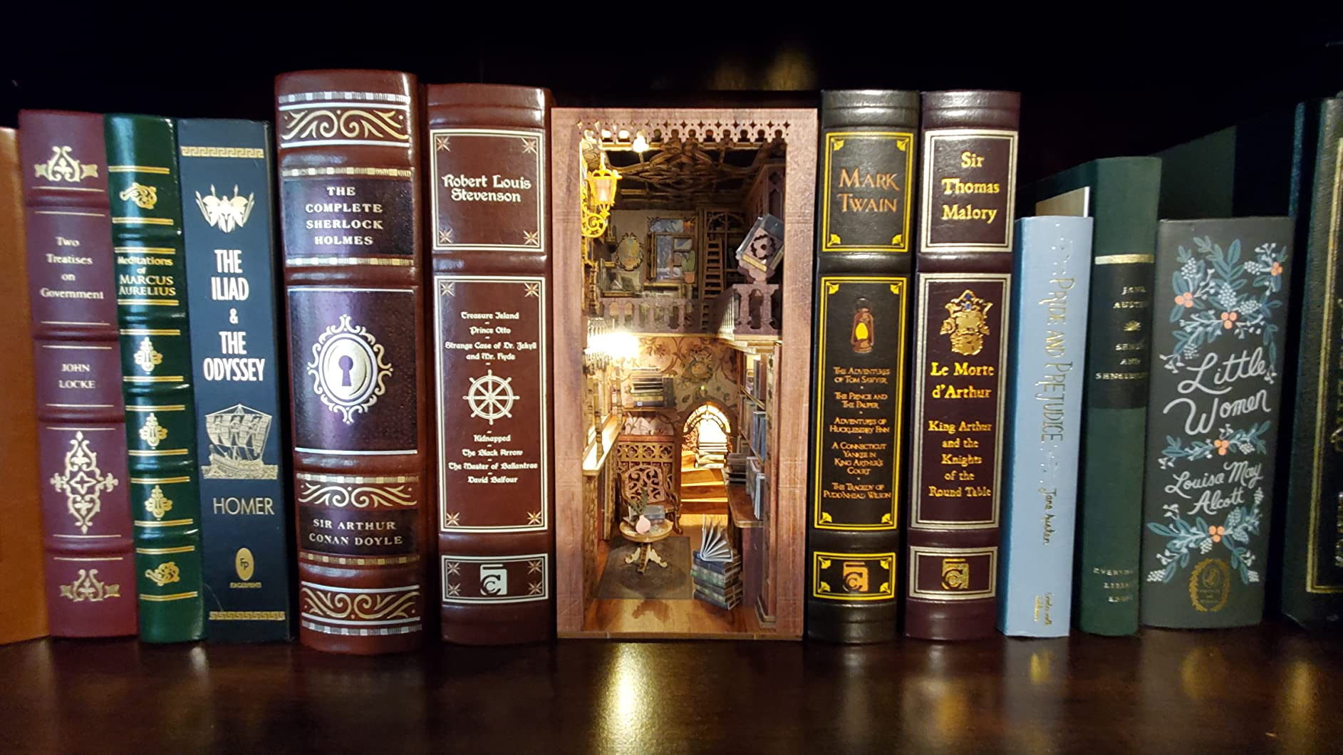 An intricate book nook place between books