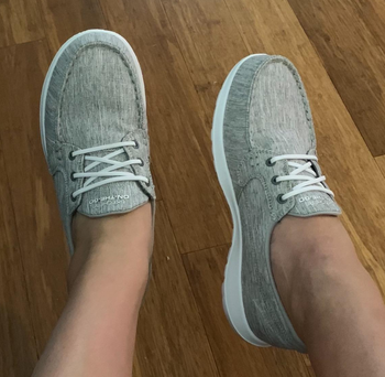 Reviewer wearing gray shoes