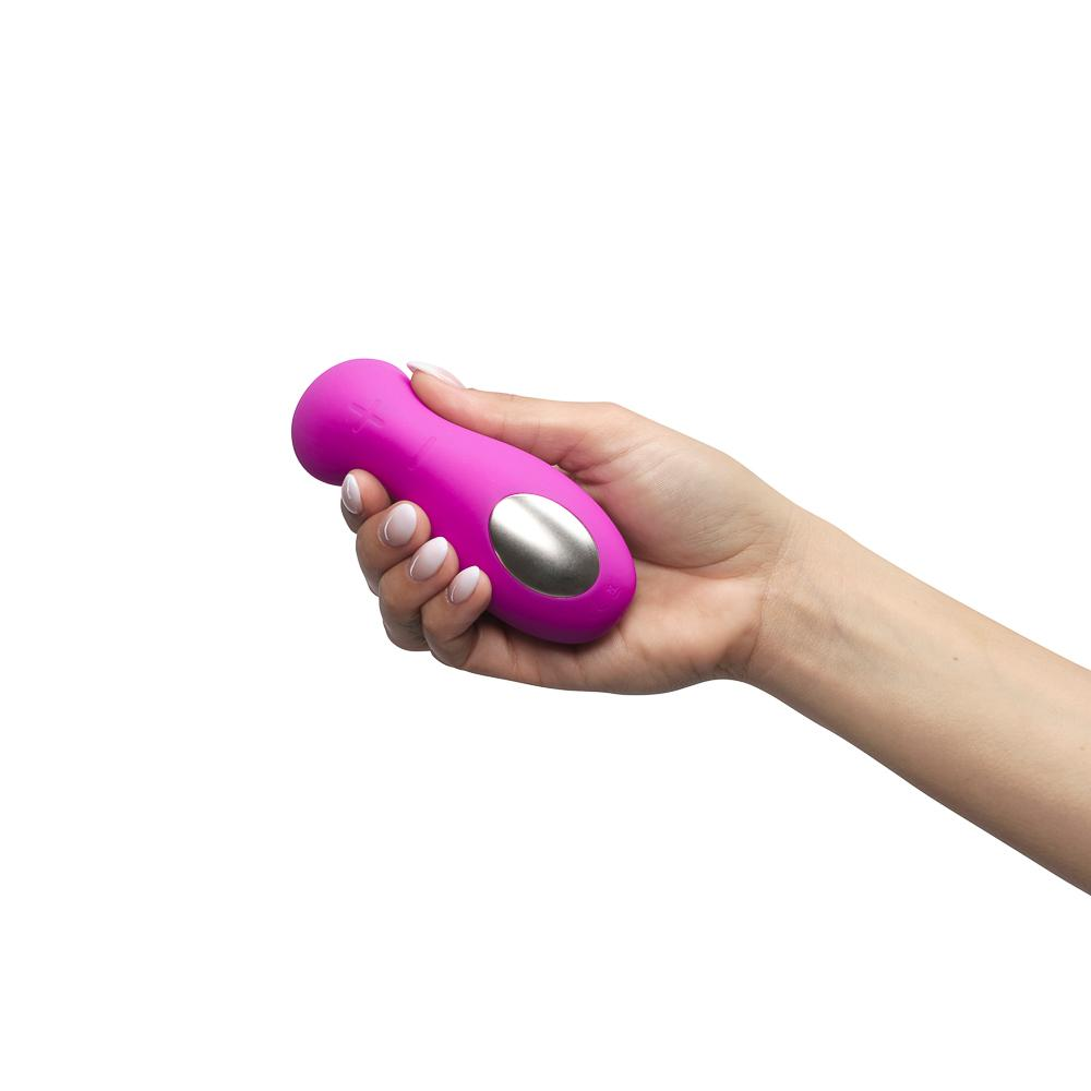 Model holding pink vibrator to show touchpad