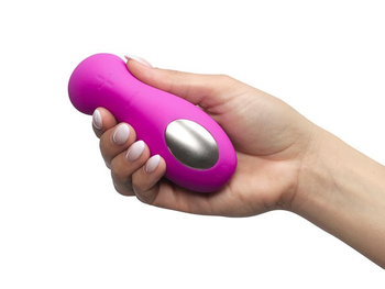 Model holding pink vibrator to show touchpad