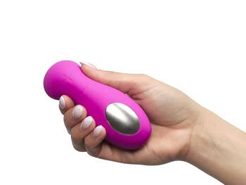 Model holding pink vibrator to show touchpad