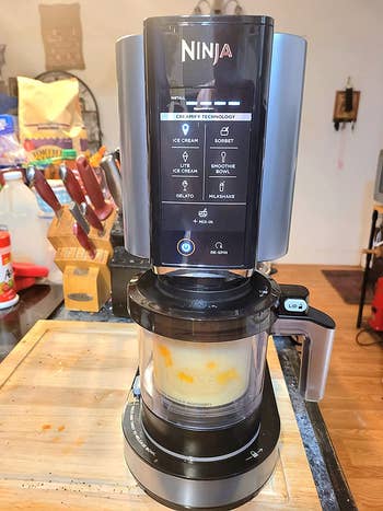 A reviewer's black Ninja with a yellow ice cream in the mixer
