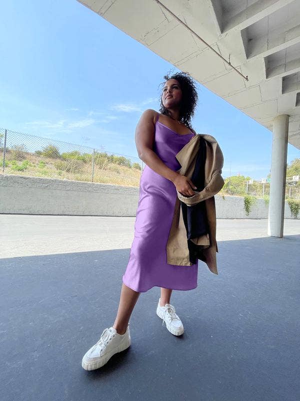 a model wearing the lilac silk dress