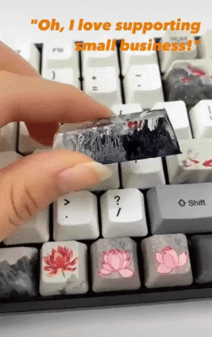 the creator showing an up close look at one of the custom keycaps and clicking it in the keyboard