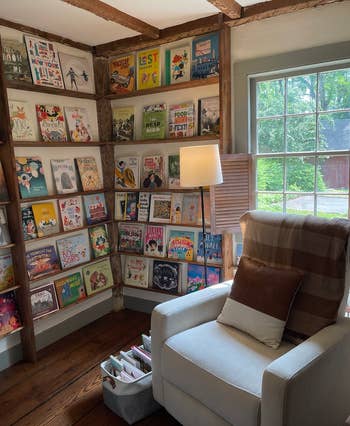 my own review image of the chair in a small room with picture books on the shelves