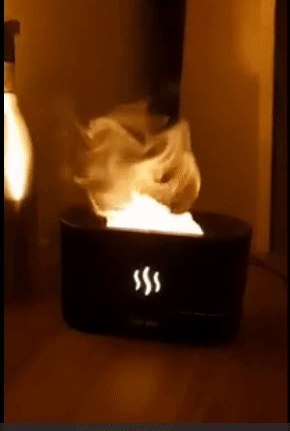 A reviewer's black humidifier with lights mimicking flames coming out of it 