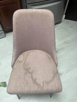 reviewer's dirty pink chair with stains