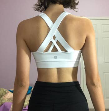 Reviewer turned around to show interlocking white straps in back 