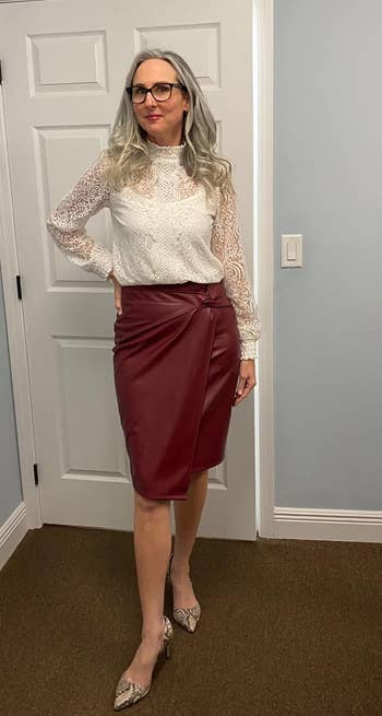 another reviewer wearing the merlot PU leather skirt with a long sleeve white bluse