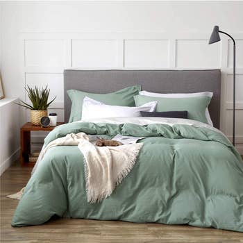 Sage green duvet on a bed 