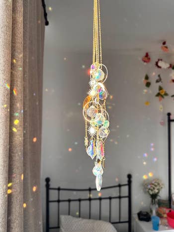 Crystal prima catcher hanging with reflective patterns connected walls,