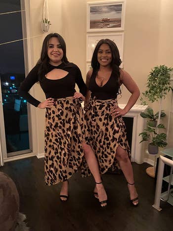Two reviewers wearing leopard wrap skirt with black tops