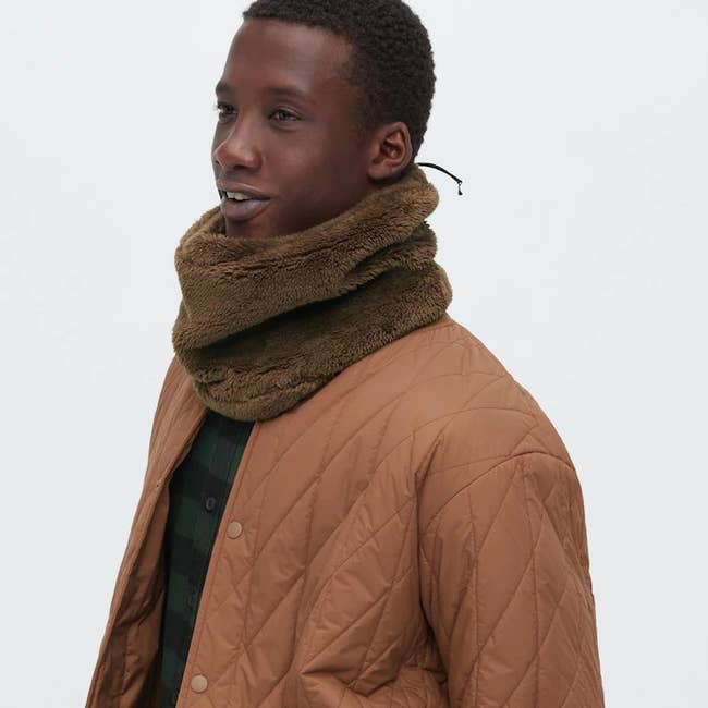 a model posing in the brown neck warmer