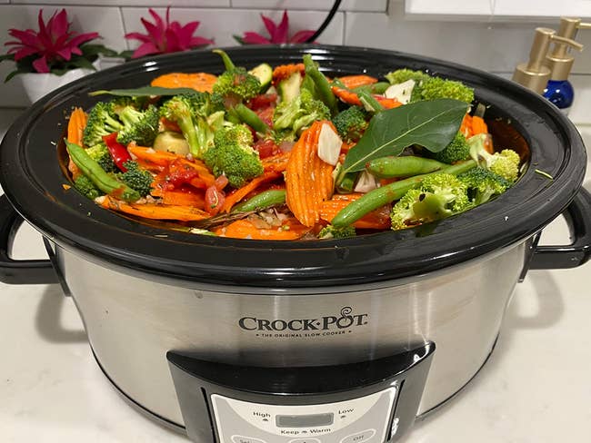 reviewer's crockpot filled with veggies