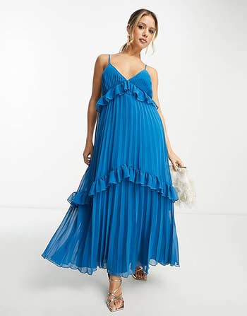 front view of a model in the pleated cobalt maxi dress