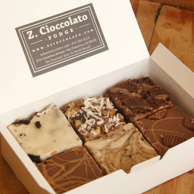 an open box of six pieces of fudge