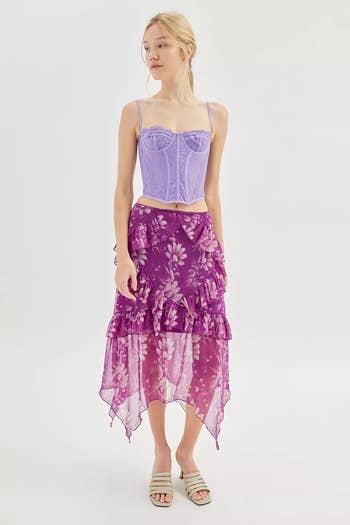 another model wearing the purple large floral printed skirt