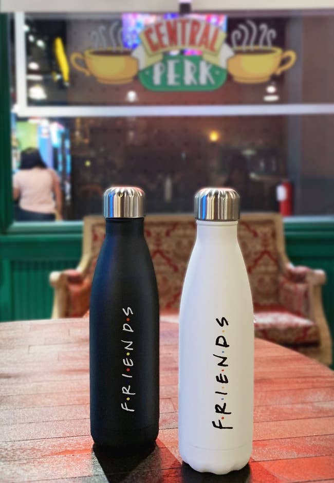 black and white water bottles with friends logo