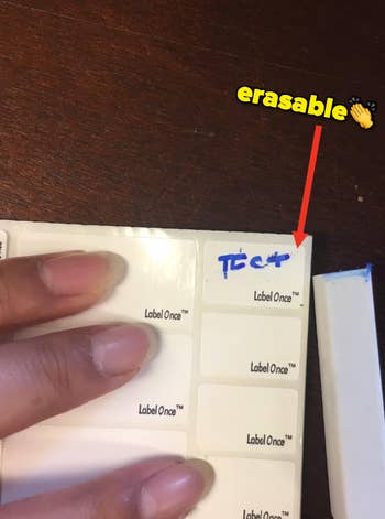 a reviewer tests the erasable marker on a label