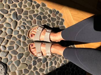 A person's feet successful  Birkenstock sandals lasting  