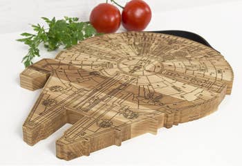 wood burned and carved millennium falcon board
