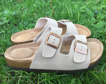 Reviewer image of taupe sandals in grass