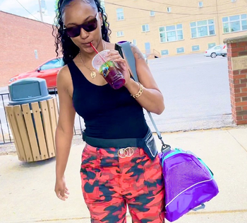 reviewer holding purple Fila gym bag
