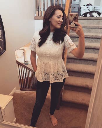 a reviewer in the high neck lace peplum top in white